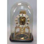 A brass fusee skeleton timepiece under glass dome H.30cm