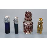 Two late Victorian silver mounted coloured glass scent bottles, a Czechoslovakian scent bottle and a