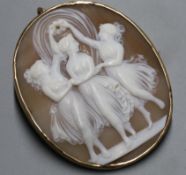 A 'Three Graces' cameo brooch in unmarked yellow metal mount, 48mm.