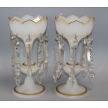 A pair of opaque white glass table lustres of tulip form, each on tapered knopped stem and