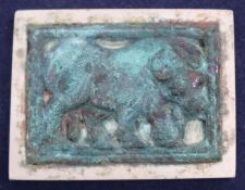 A burnt jade and bronze plaque