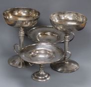 Two silver goblets and a pair of Edwardian silver two handled pedestal dishes, 24.5 oz.