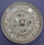 A Chinese bronze mirror 11cm diameter