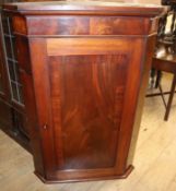 A George III mahogany corner cupboard W.87cm