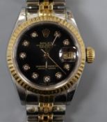 A lady's steel and gold Rolex Oyster Perpetual Datejust wrist watch, with black dial and diamond dot