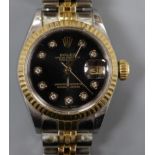 A lady's steel and gold Rolex Oyster Perpetual Datejust wrist watch, with black dial and diamond dot