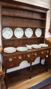 A mid 18th century style oak dresser W.143cm