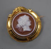 A 19th century French 18ct yellow metal mounted sardonyx cameo pendant brooch, carved with the
