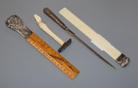 A silver moulded ivory letter opener and three other silver mounted items