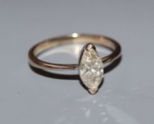 A modern 18ct white gold and solitaire marquise cut diamond ring, the stone measuring