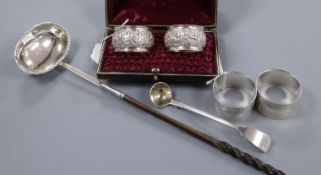 Two pairs of silver napkin rings (one cased), a George III ladle and a Georgian punch ladle with