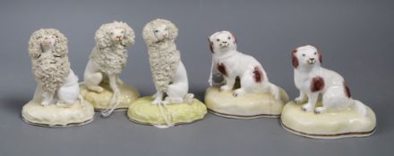 Five Samuel Alcock porcelain figures of dogs, c.1840-50, including two King Charles Spaniels and