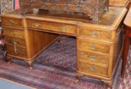 A 1920's Georgian Revival walnut pedestal desk W.152cm