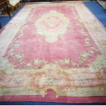 A Donegal Savonierie pattern pink ground carpet 615 x 345cm