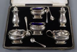 A cased George V silver six piece condiment set by Synyer & Beddoes.