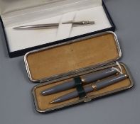 A Mont Blanc 252 grey finish fountain pen and propelling pencil set, cased and a Caran D'Ache silver