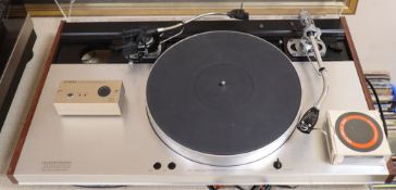 A Luxman PD444 turntable with SME 3009 arm and another SME arm and a Luxman cartridge demagnetiser