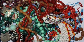 A group of assorted necklaces including agate, malachite and coral.