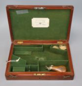 A 19th century Irish pistol box for "Rigby Dublin" and a powder flask