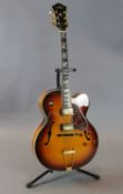 An Aria FA70 hollow body jazz guitar, vintage sunburst with soft case