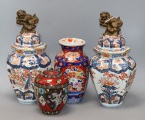 A Japanese cloisonne jar and cover and three Arita vases height 36cm