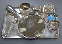 A silver dressing table tray, a silver and enamel pill box, a set of six silver coffee spoons,