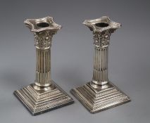A pair of Edwardian silver dwarf corinthian column candlesticks by Elkington & Co, Birmingham, 1903,