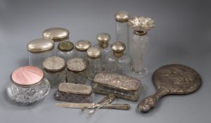 A group of assorted silver mounted dressing table items including mirror, toilet jars etc.
