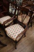 A pair of Edwardian inlaid elbow chairs