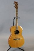 An Ozark small body acoustic guitar, no case