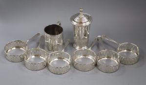 Six sterling silver ramekin holders, an Art Deco silver sugar caster and a silver Christening mug.