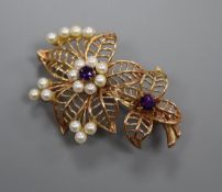 A 9ct gold, amethyst and cultured pearl set floral brooch, 43mm, gross 7.9 grams.