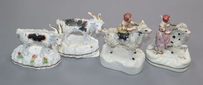 Four Staffordshire porcelain figures and groups of goats, c.1830-50, including a pair of girls