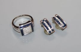 A modern 750 white metal, sapphire and diamond square cluster ring and pair of matching earclips.