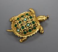 A yellow metal, emerald and diamond set brooch, modelled as a tortoise, 40mm, gross 9.9 grams.