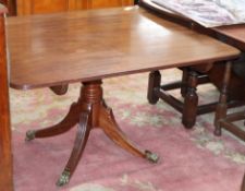 A Regency mahogany tilt top dining table W.105cm