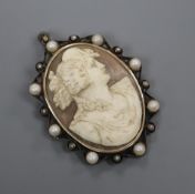 A white metal, 14ct yellow metal and cultured pearl mounted oval cameo pendant brooch, carved with