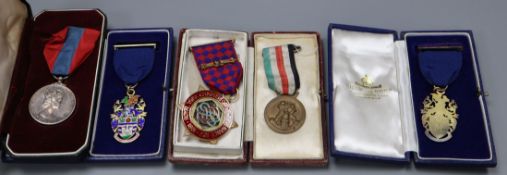 Three silver gilt and enamel medals and an ISM