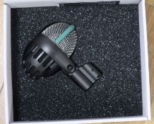 Three AKG microphones (D112 bass drum mic and two D5 vocal mics)