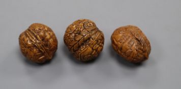 Three erotic carved walnuts