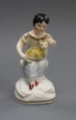 A rare Staffordshire porcelain group of a girl with a cat on her lap, c.1835-40, H. 10cmProvenance -