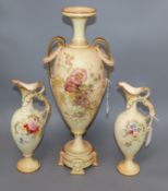 A Royal Worcester blush ivory amphora-shaped vase and a pair of similar Royal Bonn ewers, all with
