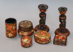 A group of Persian floral wood wares candlesticks 15cm