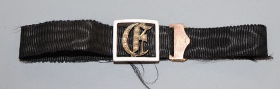 A Victorian black sash mourning bracelet, with 9ct, white enamel and seed pearl set initialled