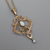 An Art Nouveau 9ct, seed pearl and white opal pendant on 9ct chain, pendant 49mm.