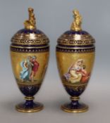 A pair of Vienna style porcelain vases and covers overall height 32cm