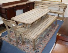 Gaze Burvill. An oak garden table, bench, low bench and pair of chairs Table L.170cm, Bench L.210cm,