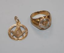 A 9ct gold and diamond set masonic ring and a 9ct gold masonic pendant.