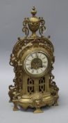 A French bronze mantel clock with enamelled Roman dial height 39cm