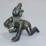 A 17th century bronze figure of Balakrishna holding a butter ball 6.5cm